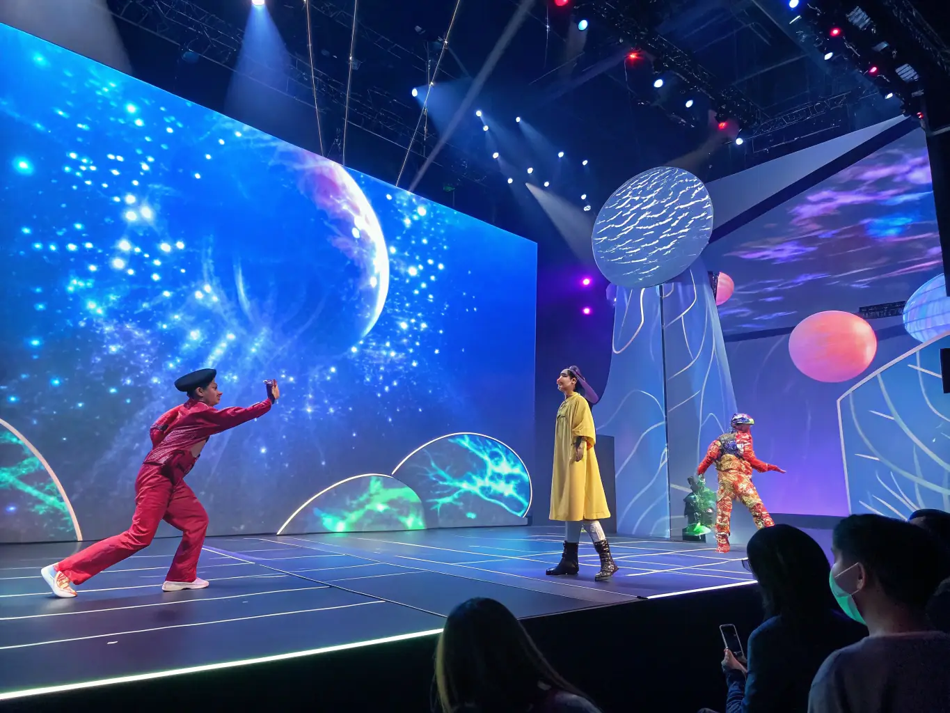 A dynamic stage shot from a Compagnie Formidable show in Paris, featuring performers interacting with video projections and circus elements.